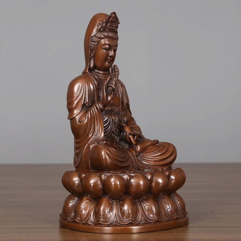 Avalokitesvara Guanyin copper statue contemplative pose showcasing peaceful spiritual presence and compassion energy
