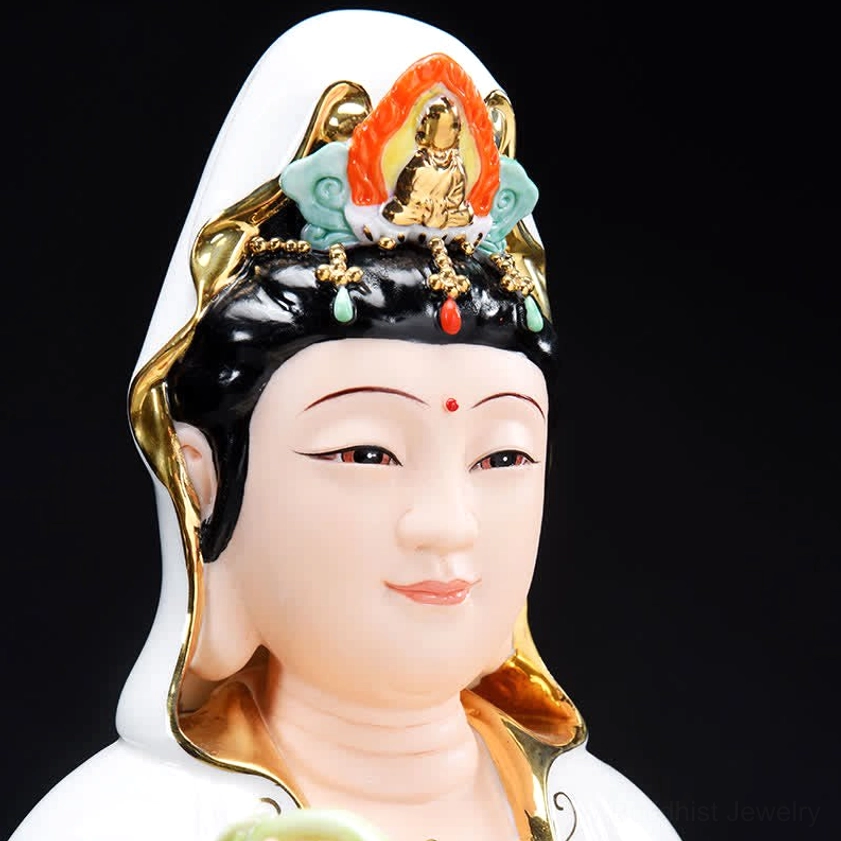 Close-up detail of Avalokitesvara Guanyin's face with painted features colorful decorative headdress