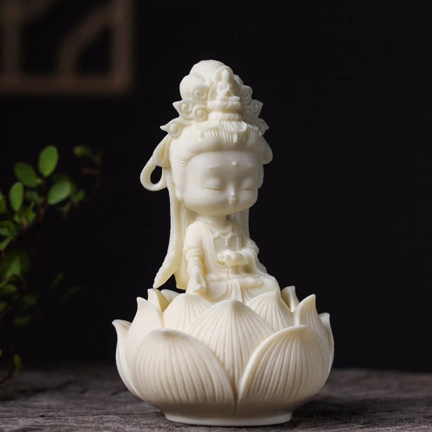 Mini Guanyin Buddha figurine seated on traditional lotus pedestal, side perspective displaying serene facial features and detailed robing