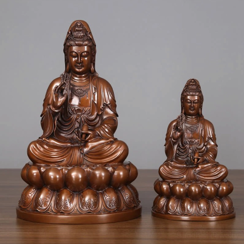 Comparison of small and medium Avalokitesvara Guanyin copper statues side by side showing scale and size difference