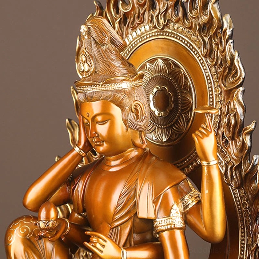 Four-armed Guanyin close-up frontal view showcasing multiple hand mudras and ornamental jewelry details