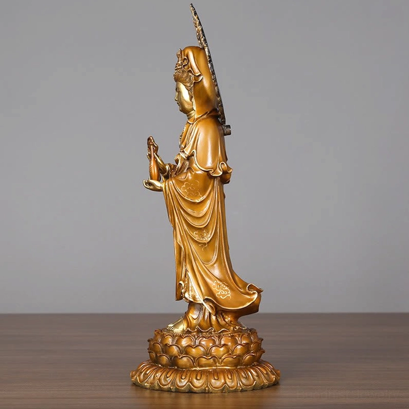 Guanyin statue left rear view with layered robes and extended halo