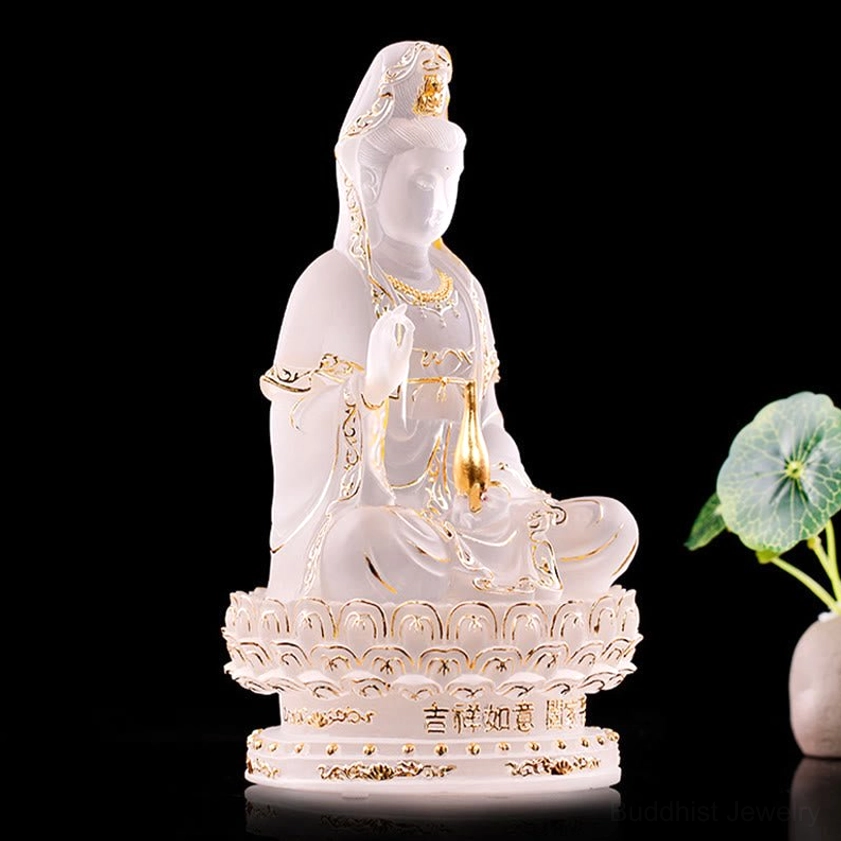 Handcrafted Liuli Guanyin figurine side profile showing frosted white glass with gold embellishments and sacred details