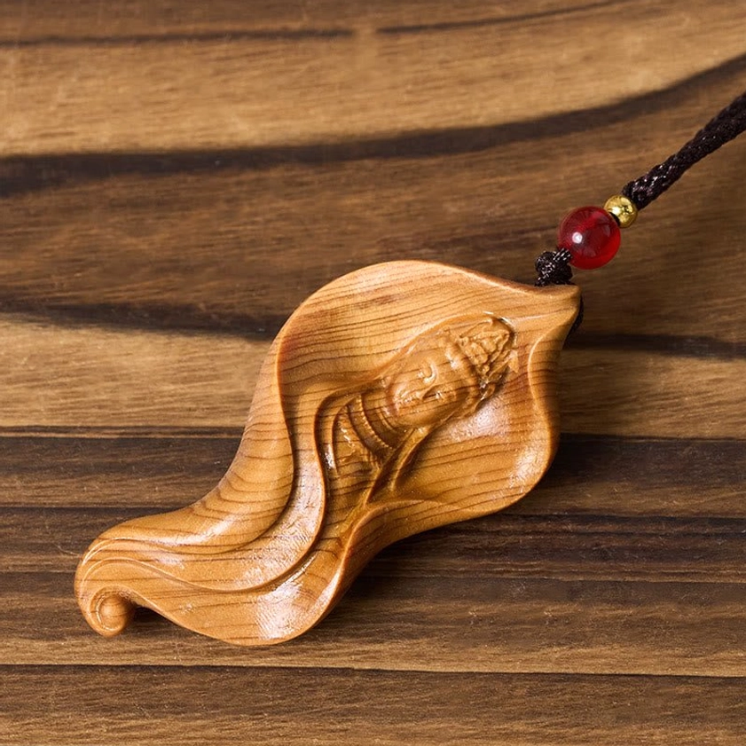 Avalokiteshvara wood necklace pendant rear angle showing reclining Guanyin lotus leaf design
