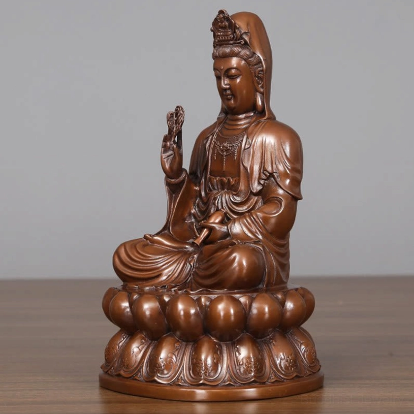 Close-up detail of Avalokitesvara Guanyin copper statue facial features showing serene expression and spiritual presence