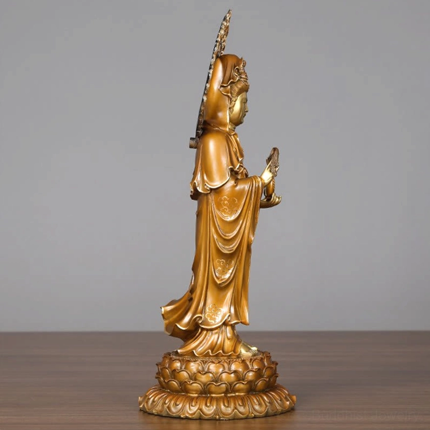 Guanyin brass statue close-up of head with intricate flame halo and facial features