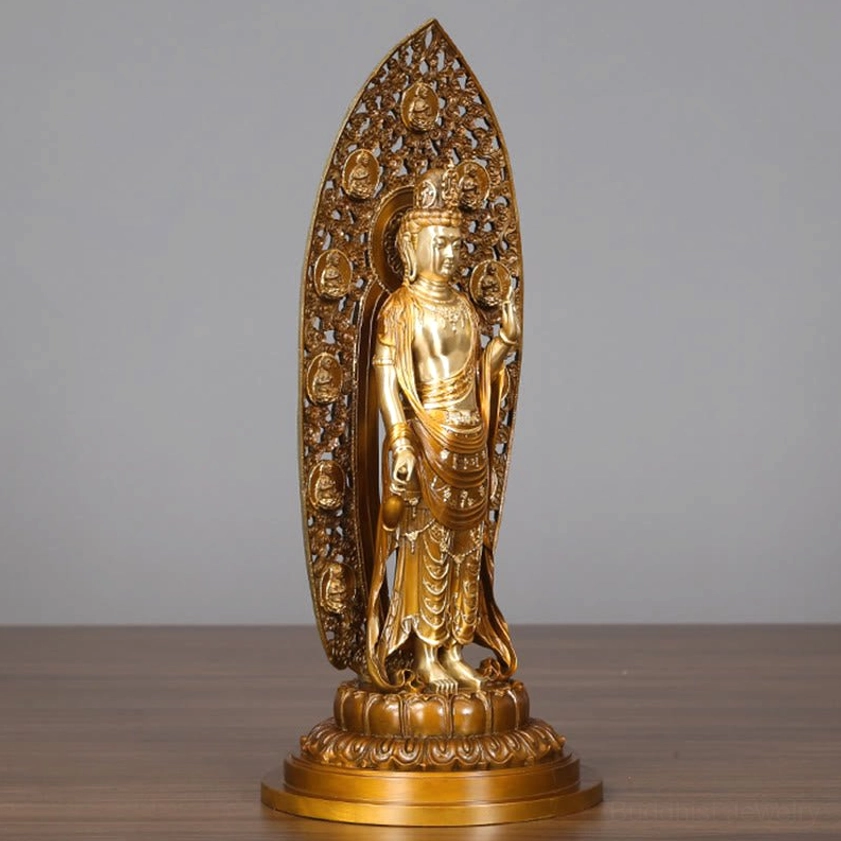 Guanyin brass statue left side profile - showing detailed sacred robes, lotus base, and ornamental backplate design