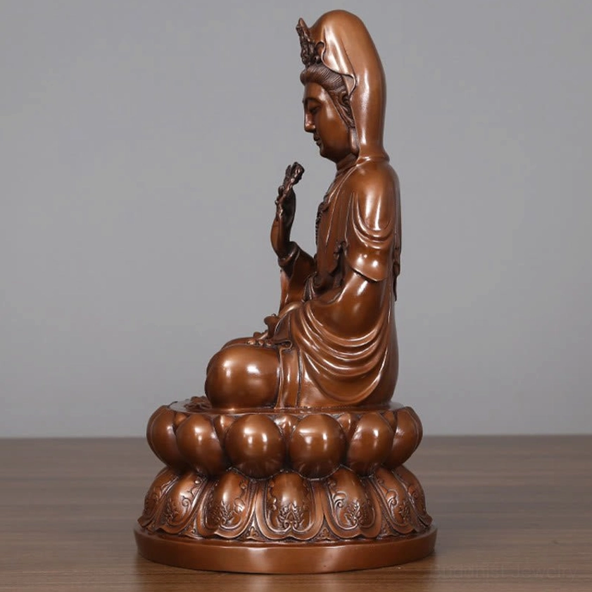 Avalokitesvara Guanyin copper statue right side three-quarter view showing hand gesture and carved lotus pedestal