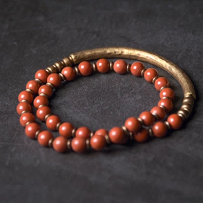 Red jasper bead bracelet with hammered texture copper cuff - flat lay showing handcrafted couple jewelry set