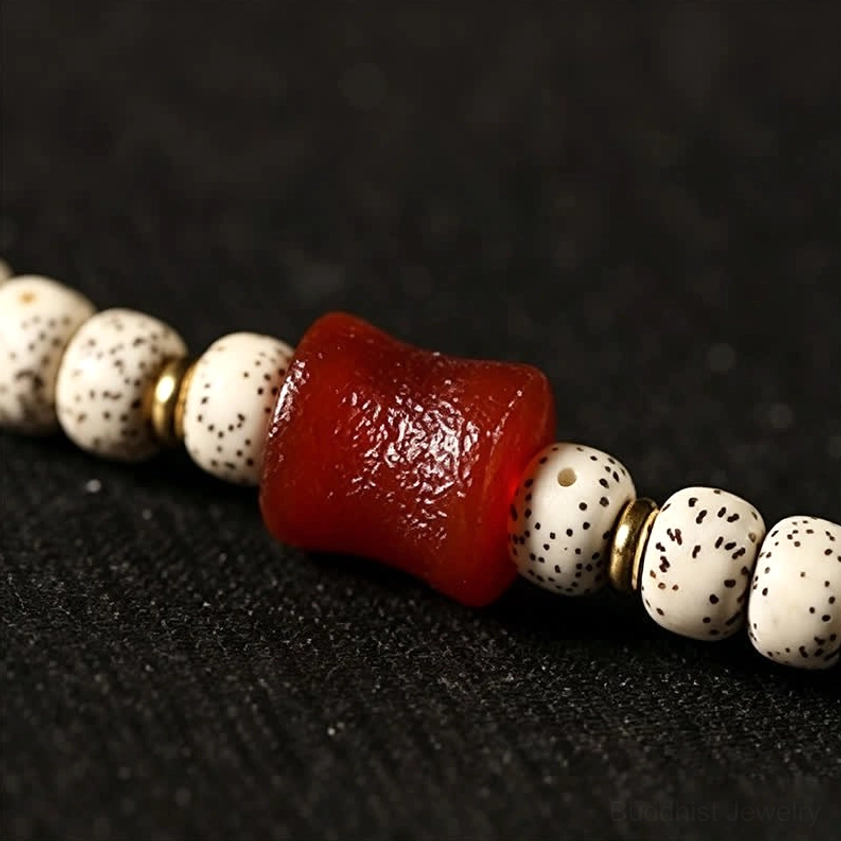Handcrafted Dzi Bead amulet pendant showcasing intricate hand-painted sacred patterns for spiritual protection