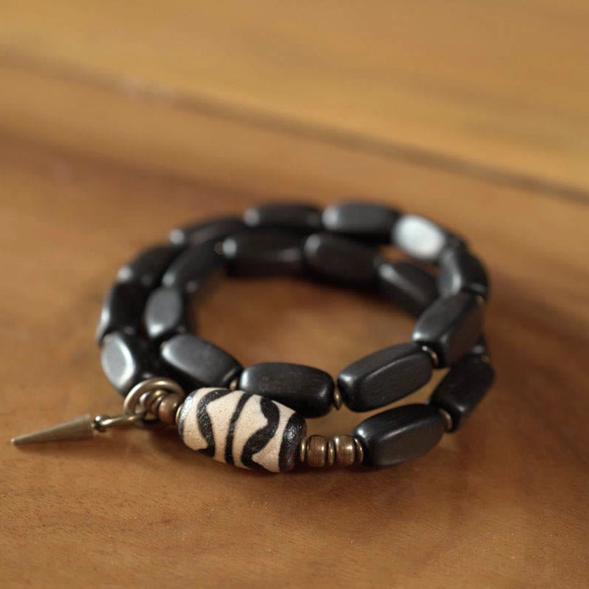 Hand-painted nine-eye dzi bead bracelet showing authentic stone craftsmanship
