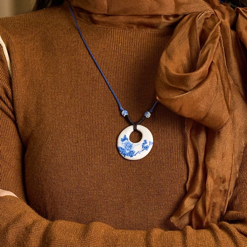 Buddhist ceramic pendant necklace detailed close-up view showing hand-painted peony flowers on rope