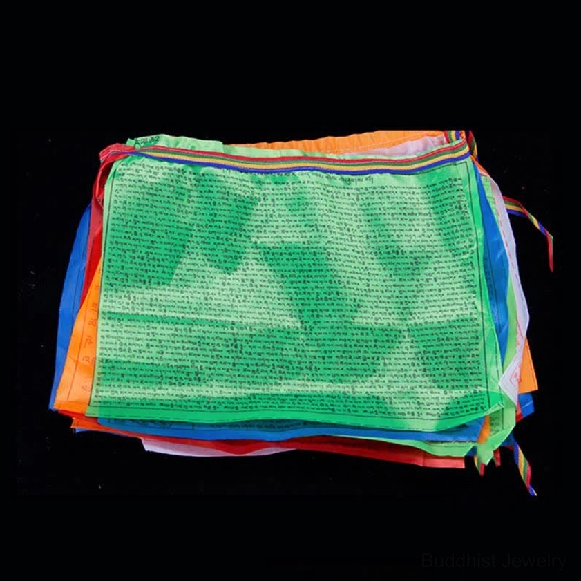 Close-up texture and print quality of hand-printed Buddhist windhorse prayer flags showing artisan craftsmanship