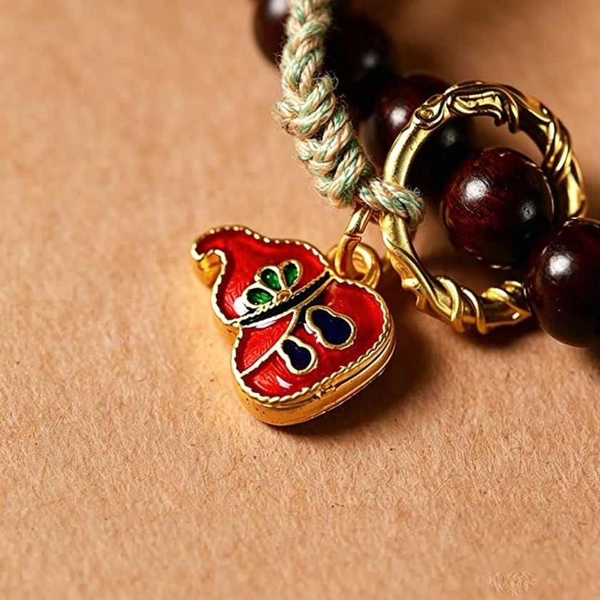 Full length view of hand-woven 108 bead red rosewood mala with peace buckle and tassel, styled for meditation and spiritual practice showcase