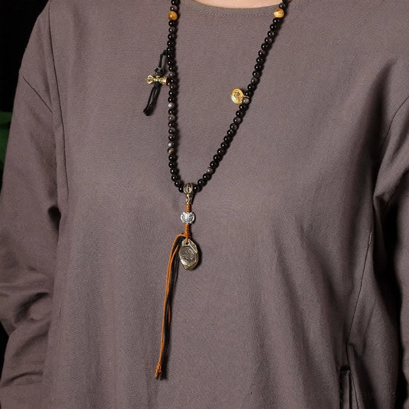 Hand-woven Silver Sheen Obsidian Garuda protection necklace featuring artisan craftsmanship and quality materials