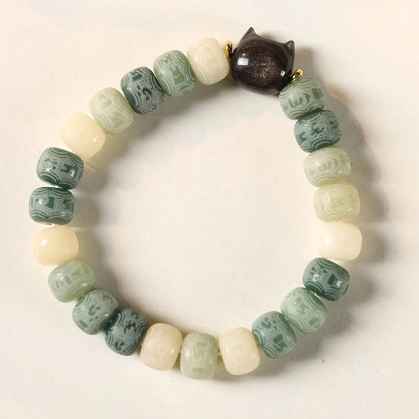 Artisan handcrafted bodhi seed bracelet showing quality construction and spiritual mantra bead carving