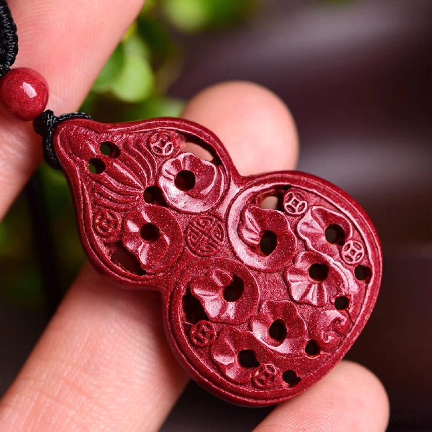 Handcrafted cinnabar laughing Buddha Buddhist pendant necklace with traditional carving on wine-red stone
