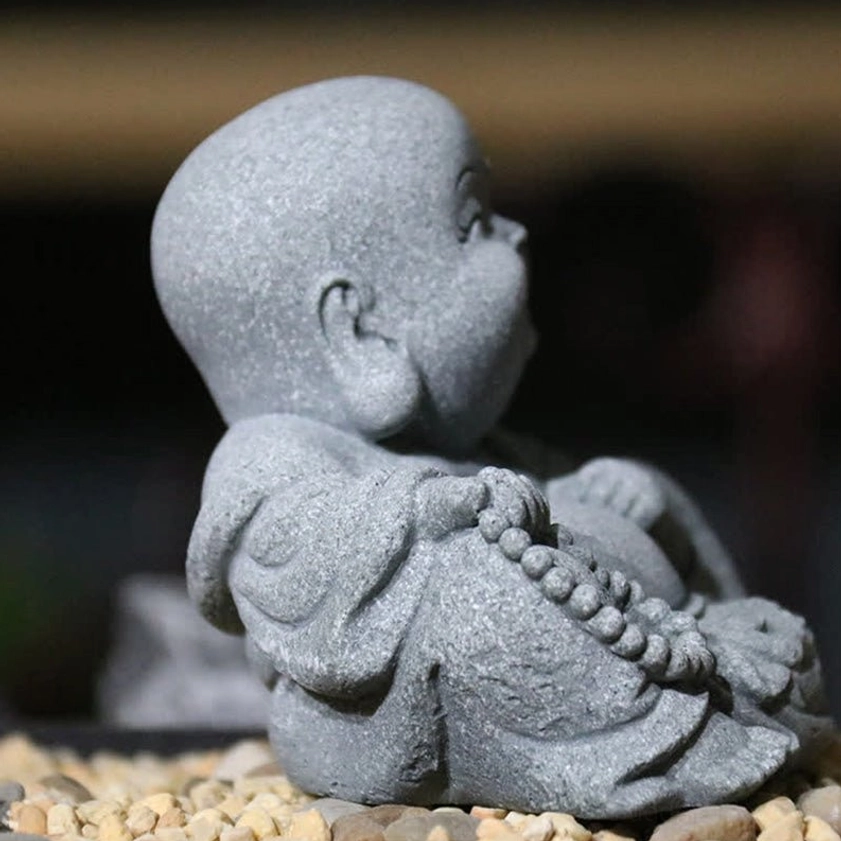 Handcrafted sandstone Buddha figurine showing authentic natural stone variations, ideal for feng shui and mindfulness decoration