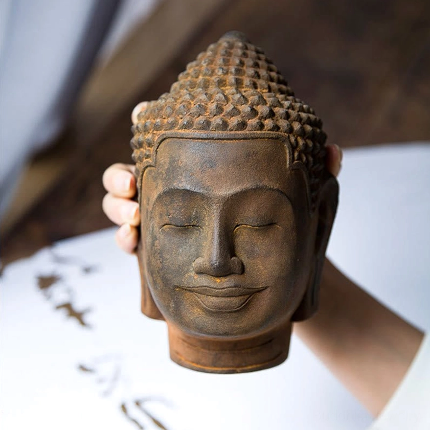 Authentic handcrafted meditating Buddha head sculpture with iron powder resin construction and aged patina appearance
