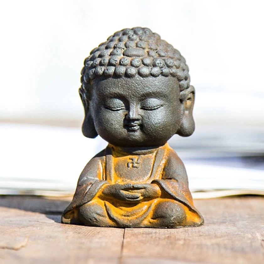 Handcrafted iron powder resin Buddha statue with rustic weathered bronze patina finish and yellow accent robes