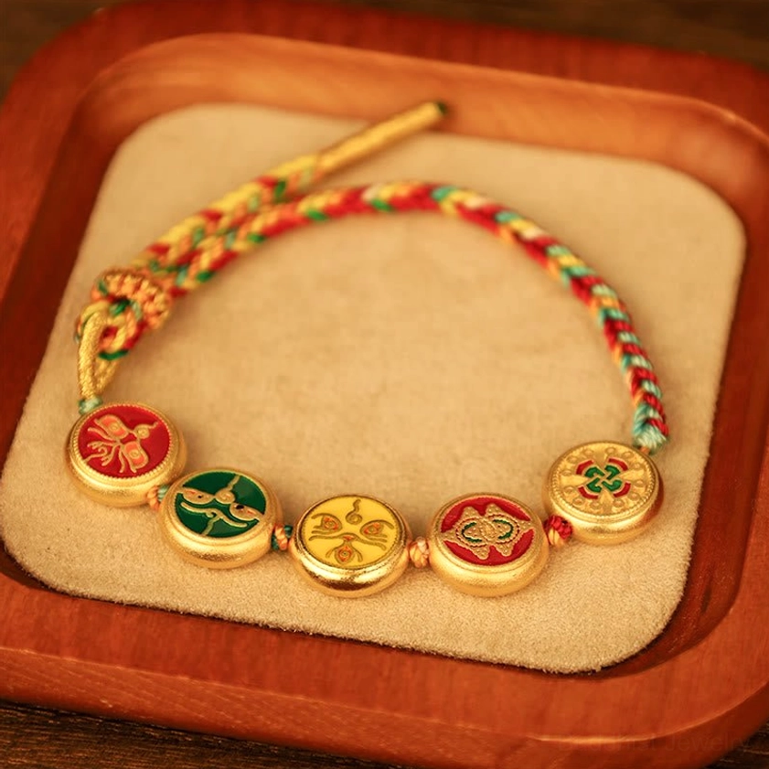 Handcrafted five wealth deities braided bracelet with natural materials showing multicolor woven rope and traditional Buddhist charm design
