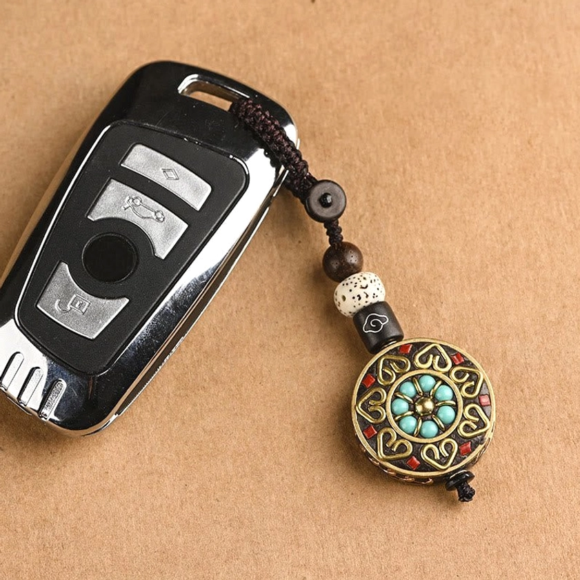 Handcrafted Buddhist keychain featuring sacred symbols for spiritual practice and daily mindfulness