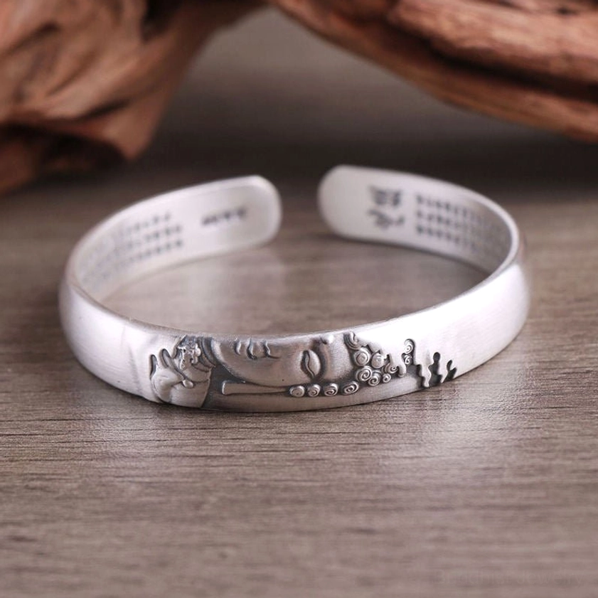 Natural handcrafted sterling silver Buddha head bracelet with sacred sutra inscriptions, matte finish showing genuine artisan craftsmanship and spiritual energy