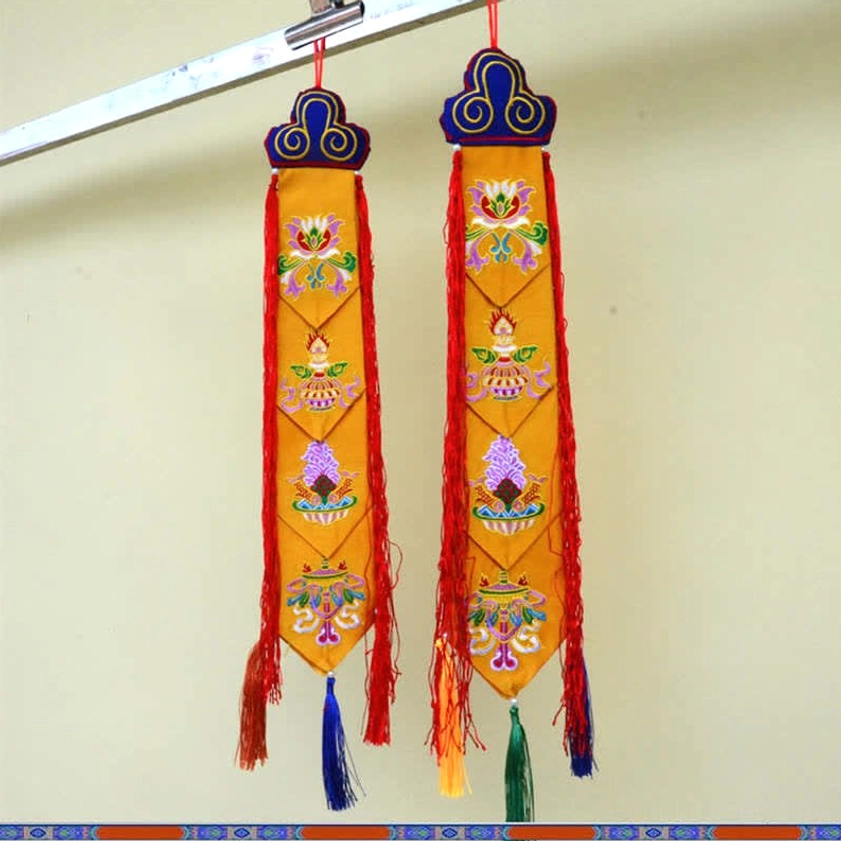 Handcrafted Buddhist tassel decoration showcasing intricate embroidery and natural materials