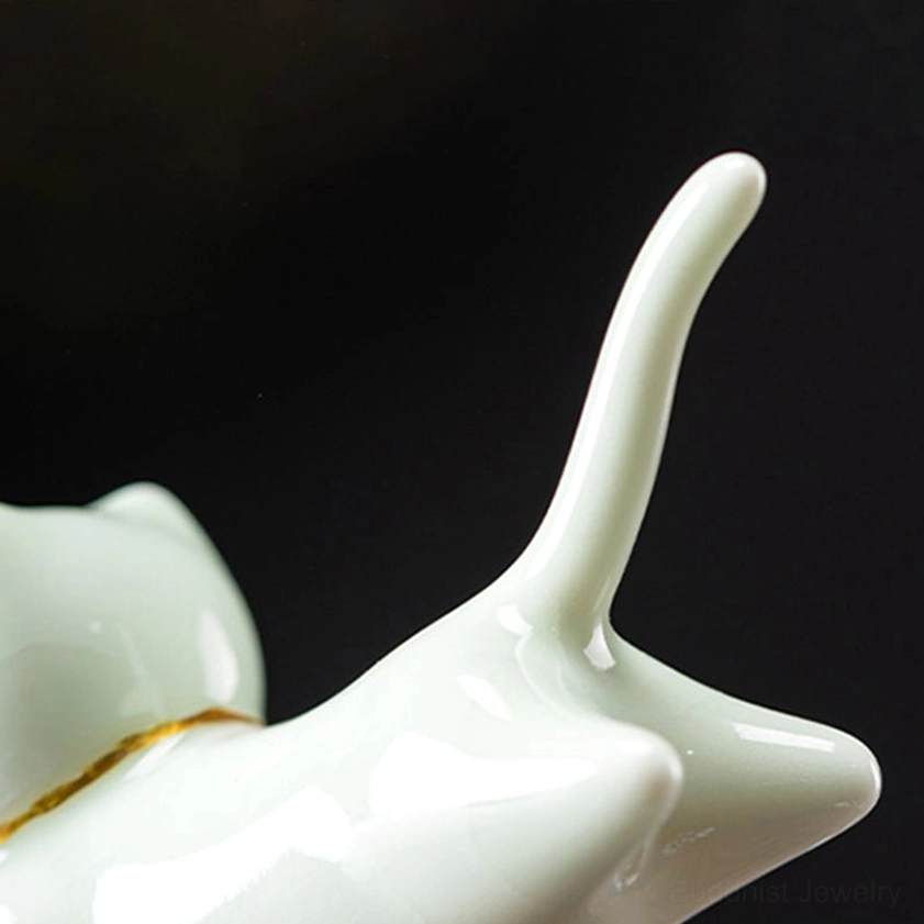 Handcrafted ceramic cat incense burner with incense stick inserted, demonstrating proper use for Buddhist meditation and spiritual practice