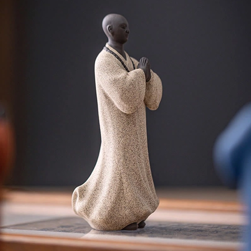 Handcrafted ceramic Buddhist monk statue with detailed craftsmanship and authentic spiritual design