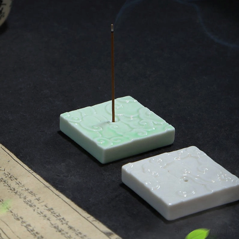 Detailed view of handcrafted ceramic cloud incense burner highlighting artisanal craftsmanship, embossed auspicious cloud pattern, and premium glaze finish