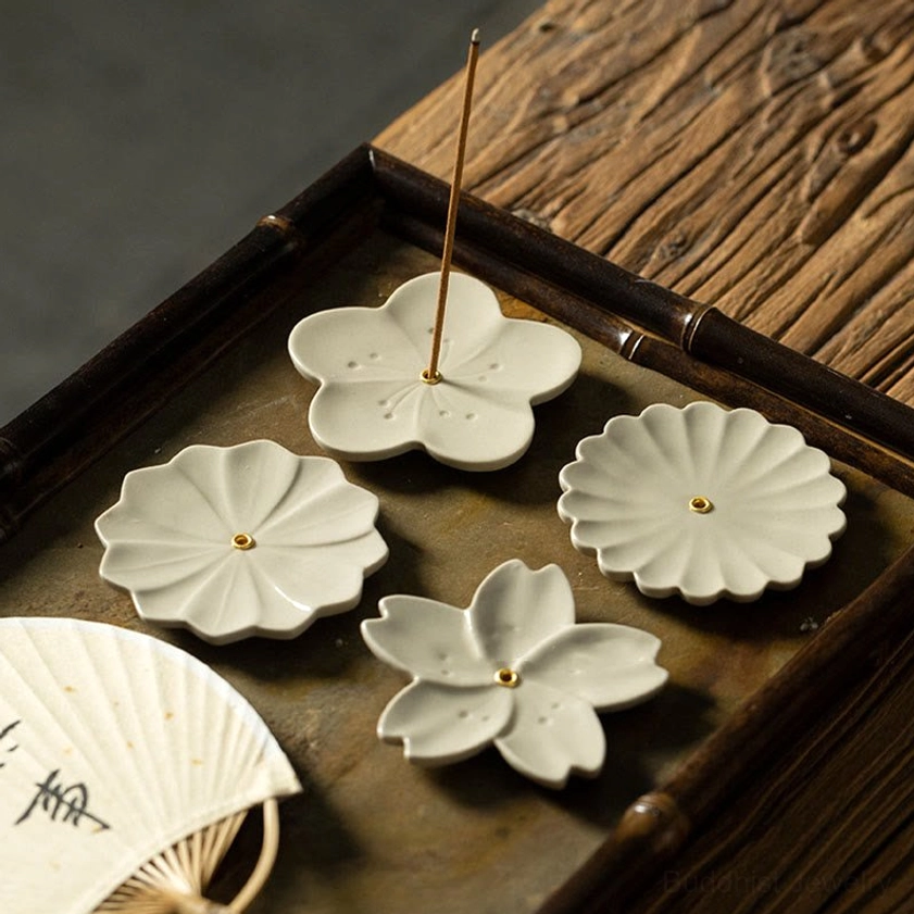 Handcrafted ceramic incense burner with natural floral design and metal holder pin