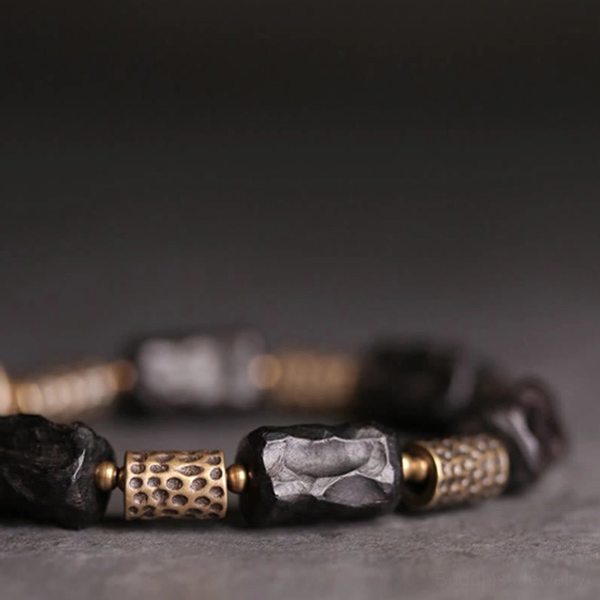 Handcrafted ebony wood and copper Buddhist protection bracelet detail
