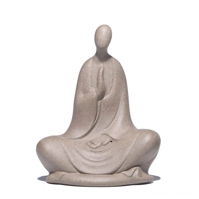 Handcrafted faceless Buddhist ceramic statue - full front view on white background