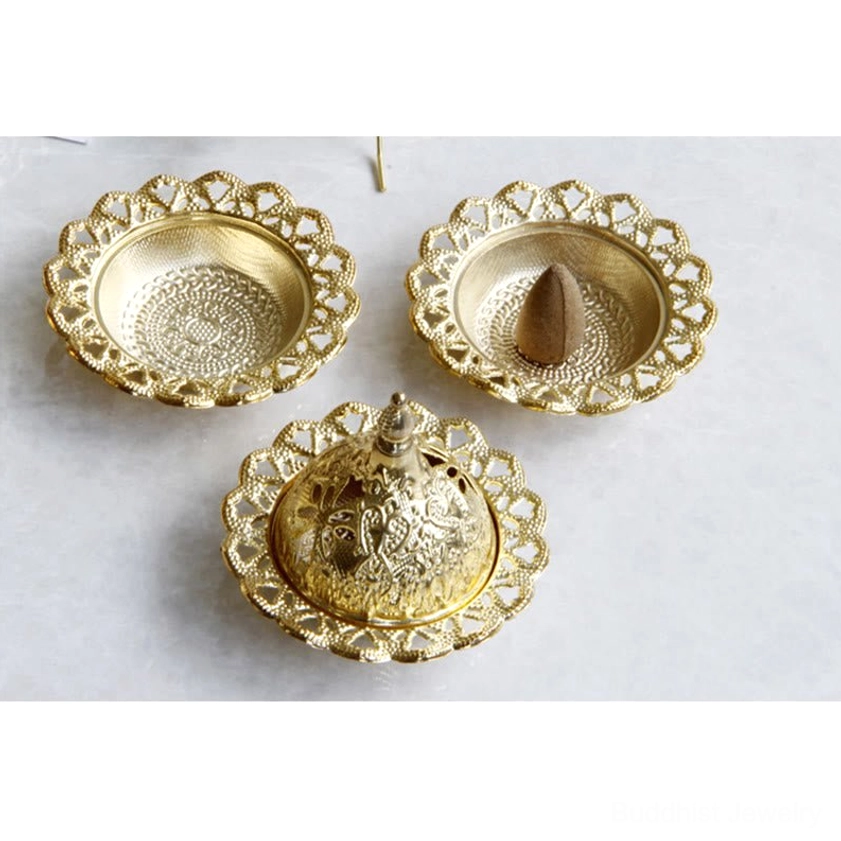 Handcrafted gold incense burner with authentic Buddhist design and natural material construction