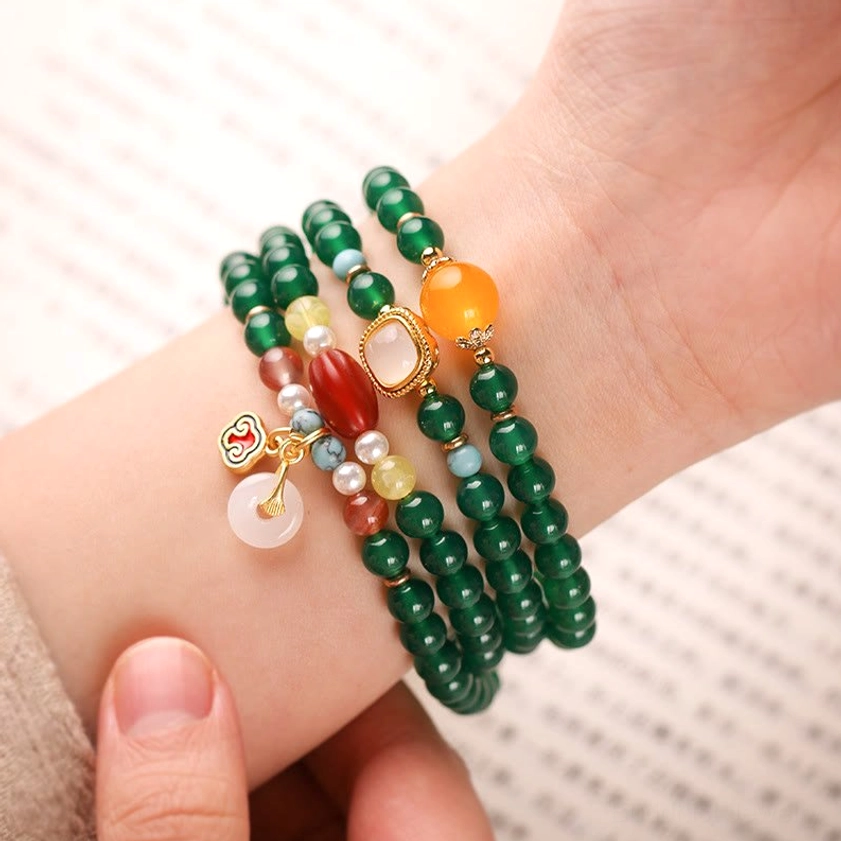 Handcrafted green agate mala bracelet with natural gemstone beads and traditional peace buckle charm