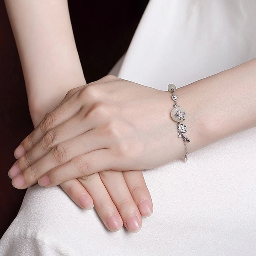 Handcrafted Hetian jade peace buckle bracelet with natural jade beads and sterling silver chain for spiritual wellness
