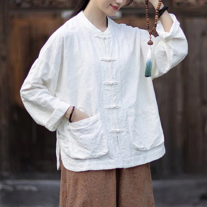 Close-up of handcrafted jacquard weave pattern on women's zen meditation shirt