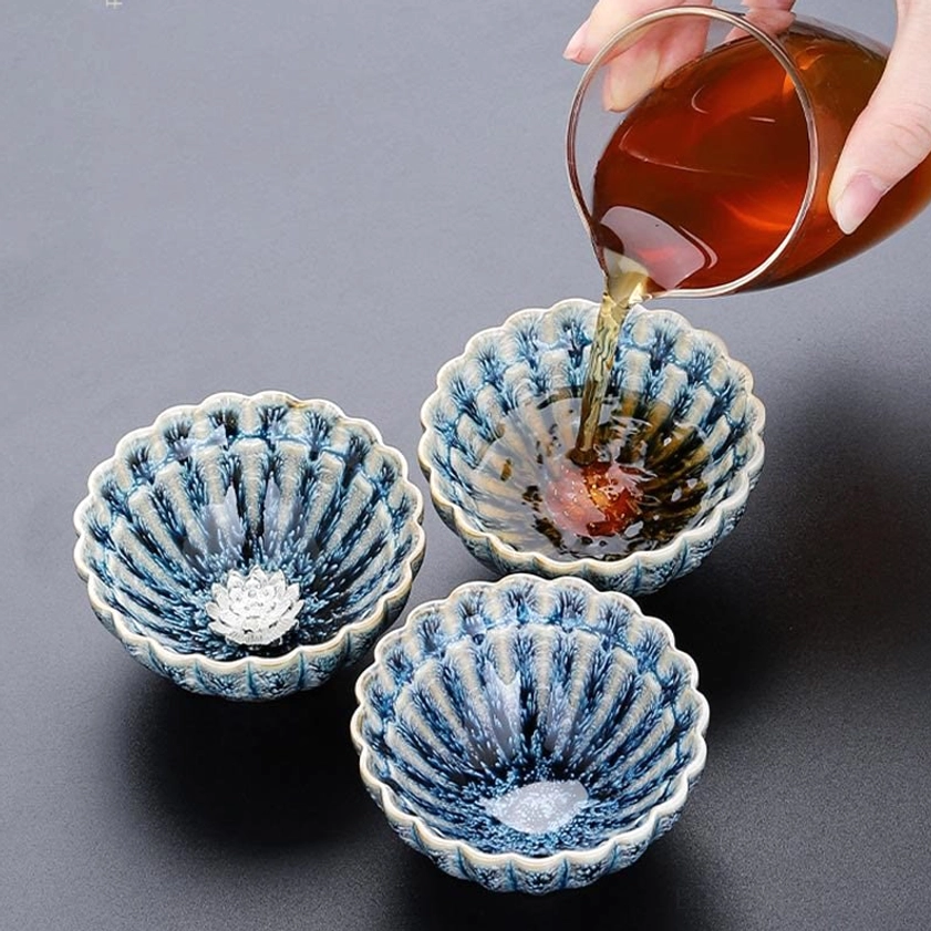 Authentic handcrafted jian zhan lotus teacup with natural kiln firing effects and blue glaze