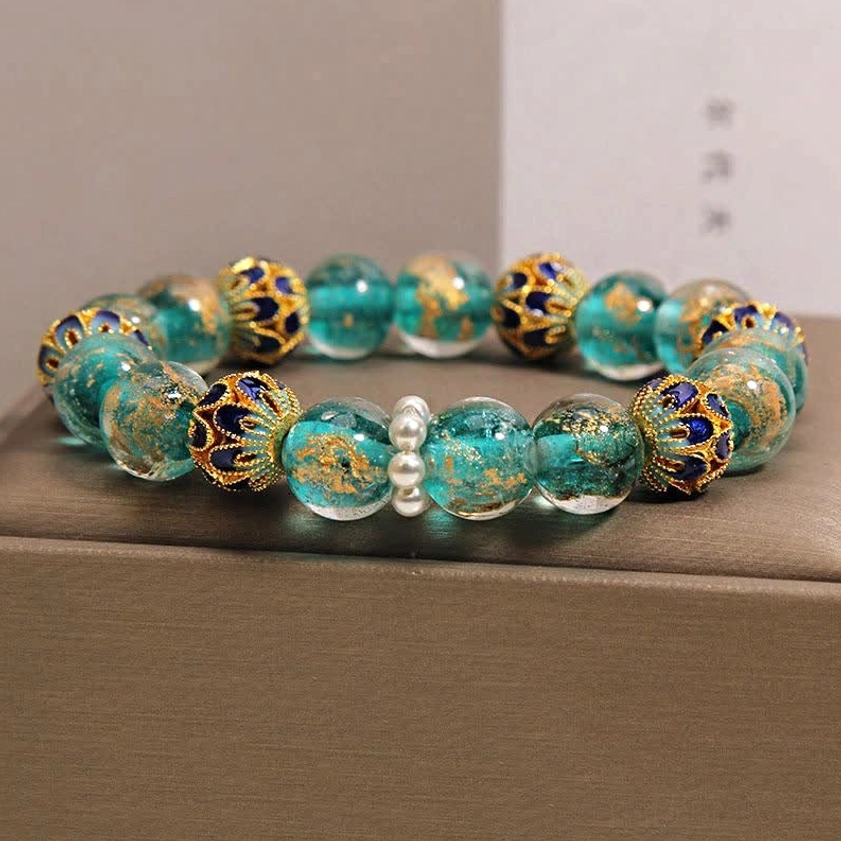 Handcrafted Liuli glass cloisonné Buddhist bracelet with intricate gold leaf detailing and pearl beads