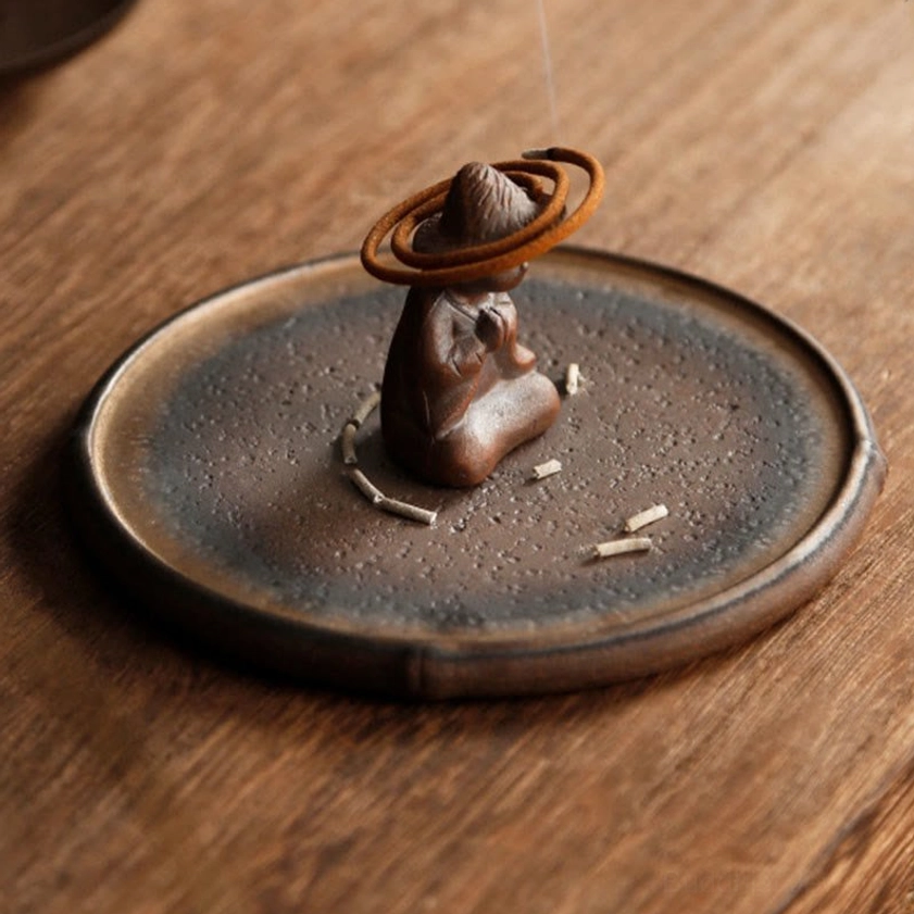 Artisan handcrafted ceramic monk incense burner details and design elements showcasing meditative figurine craftsmanship