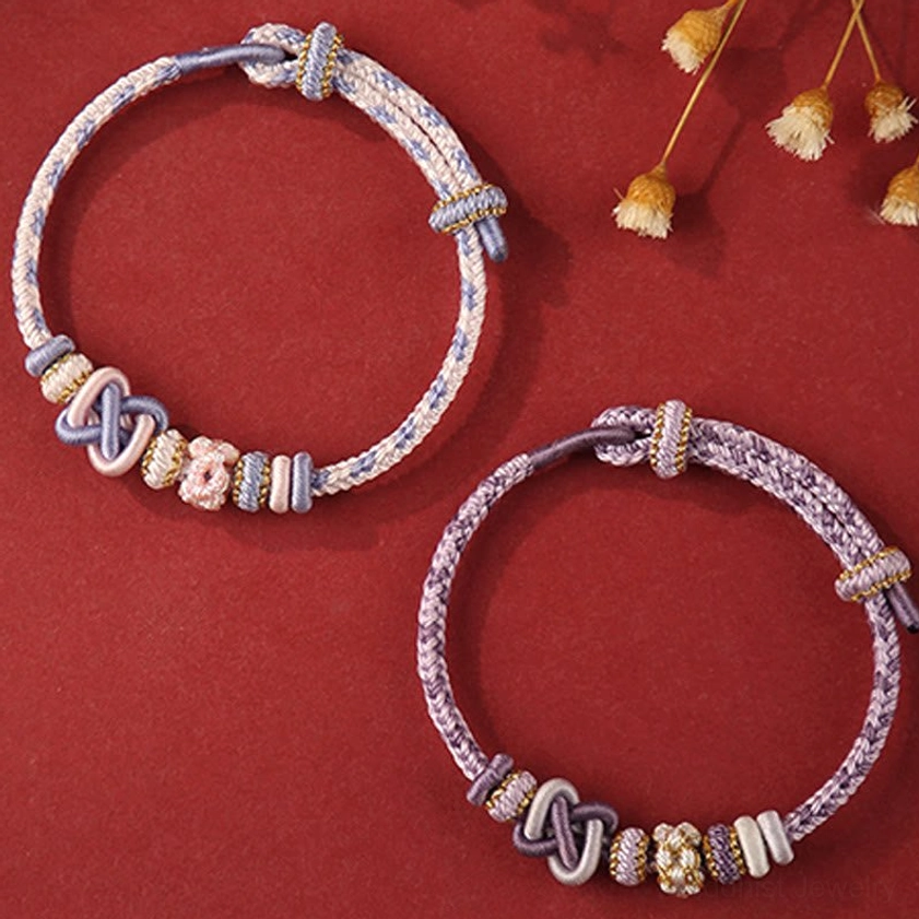 Handcrafted colorful peace knot Buddhist bracelet detail shot showing artisan quality construction with natural materials