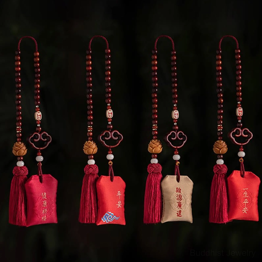 Handcrafted red sandalwood sachet with lotus symbol, cinnabar and agate beads, wooden charms, and traditional red silk tassel