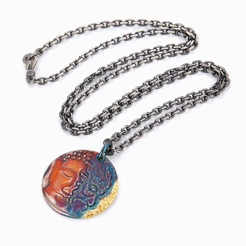 Handcrafted sterling silver Buddha demon coin pendant necklace showcasing artisanal quality, patina finish, and protective spiritual symbolism