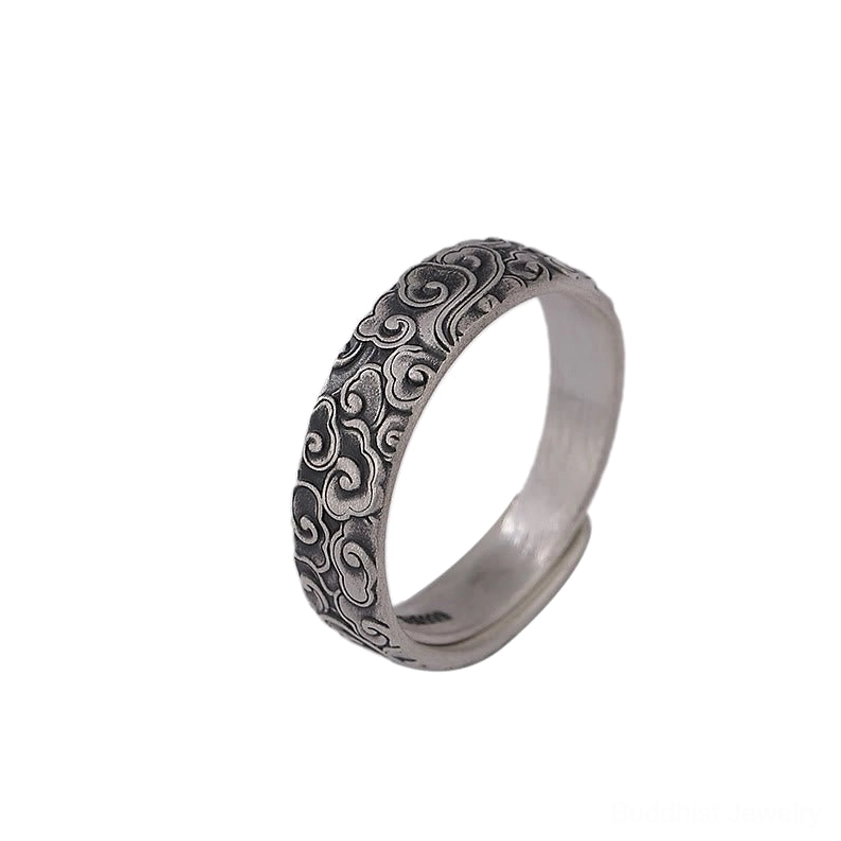 Artisanal close-up of handcrafted 999 sterling silver Buddhist ring highlighting detailed engraving work and authentic antique silver patina finish