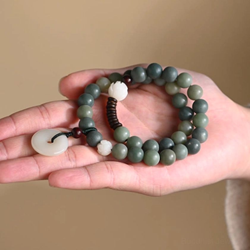 Handmade double wrap bodhi seed bracelet with elastic string featuring cyan beads, jade peace buckle, and lotus accent details