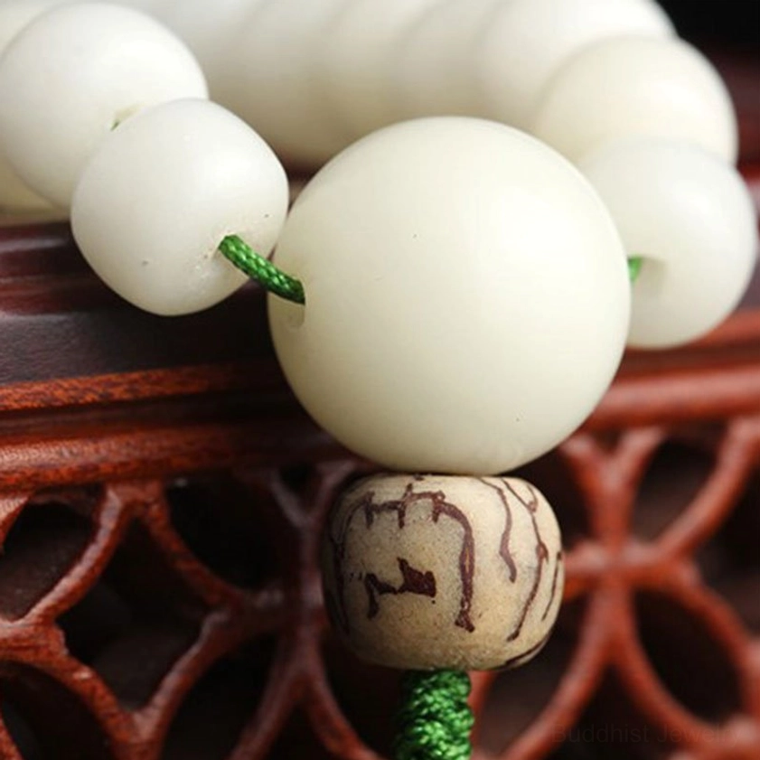 Handmade bodhi seed mala with lotus accent, traditional Buddhist spiritual meditation tool