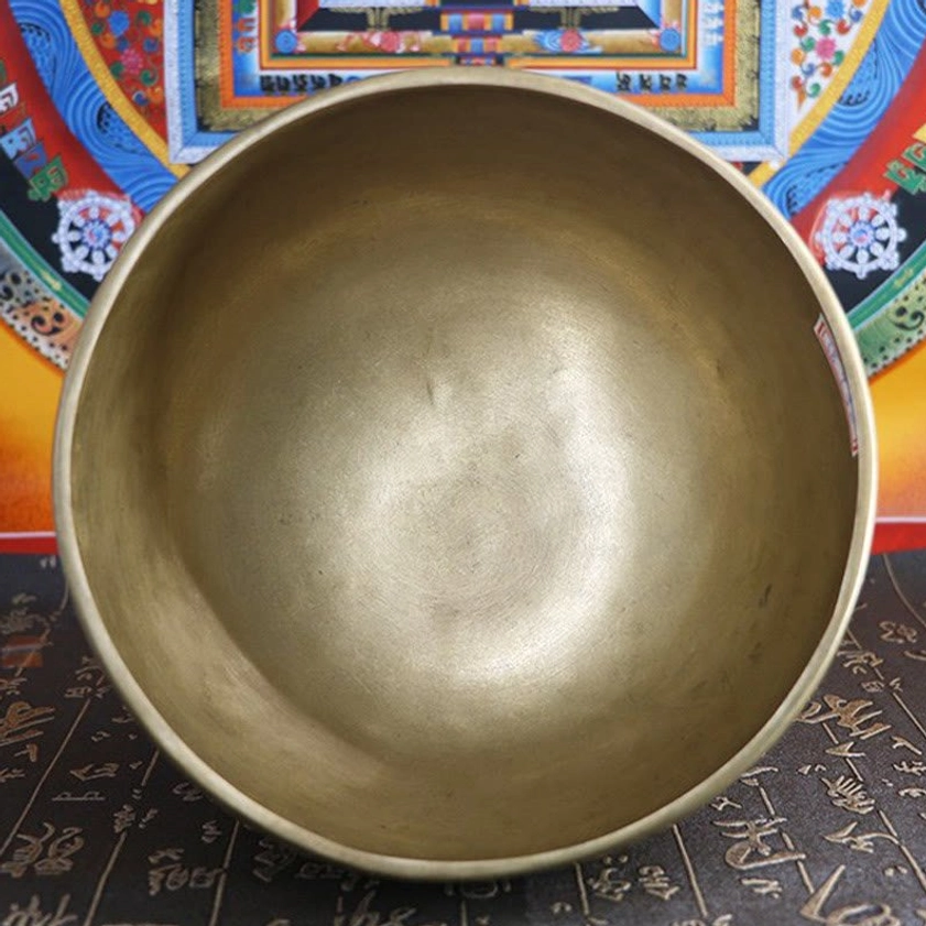 Handmade brass singing bowl detail showing authentic hammer marks and natural patina