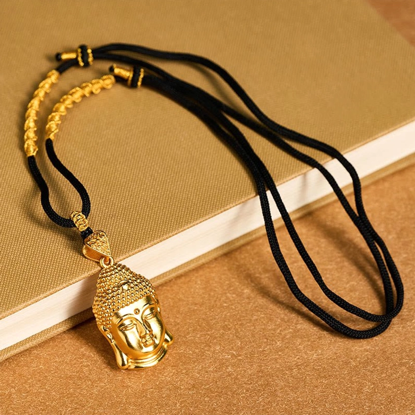 Handcrafted Buddhist pendant necklace featuring embossed Buddha facial features