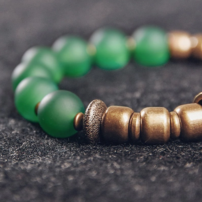 Handmade Buddhist agate bracelet with elastic cord showing craftsmanship and natural gemstone authenticity